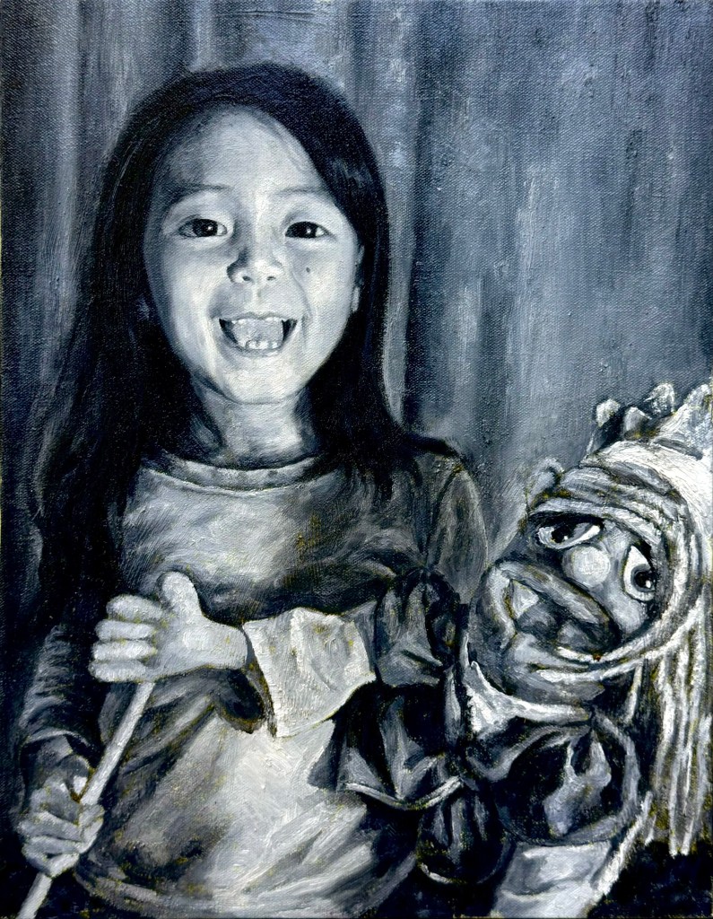 A black and white painting of a young girl smiling while holding a puppet, showcasing a joyful and playful moment.